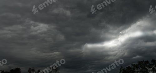 Preview: storm clouds timelapse The sun shines through the rain clouds, black clouds sky nature background