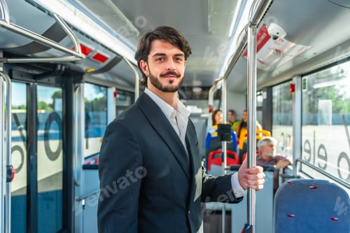Preview: Businessman commuting on public transport standing in bus