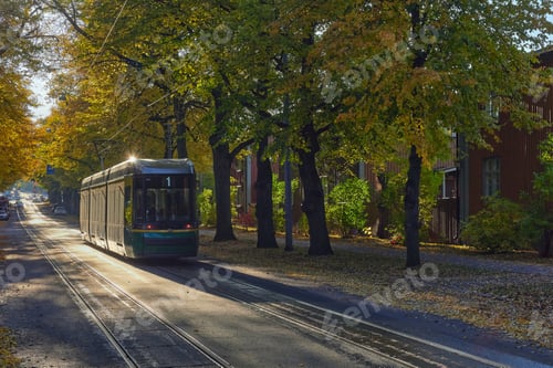 Preview: Tram in European city in autumn.