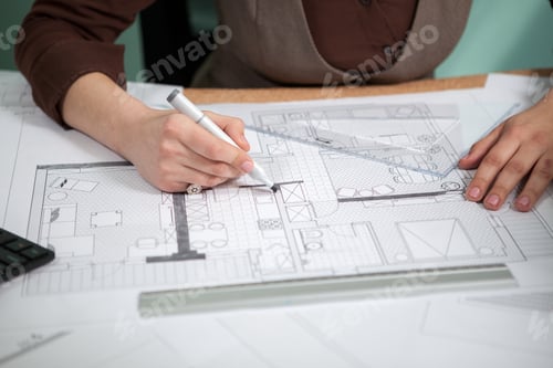 Preview: Details shot of architect blueprints on a desk