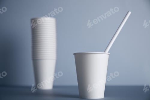 Preview: White paper cups isolated on gray mockup set