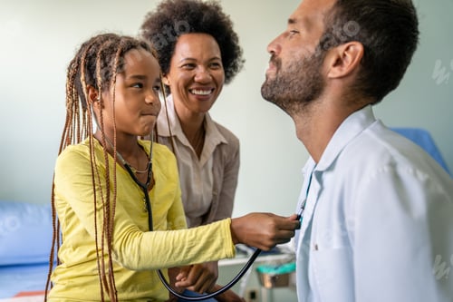Preview: Pediatrician examining a little african girl at hospital. Healthcare, people concept