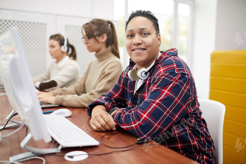 Preview: Female Students using Computer in Library