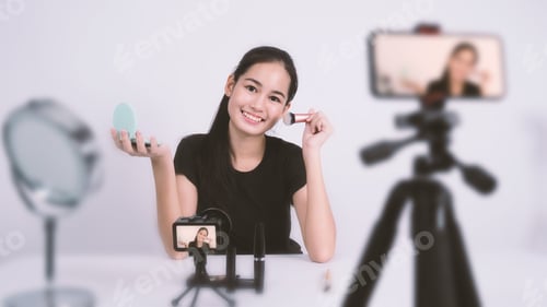 Preview: Asian teen woman sit in front of camera and live broadcasting