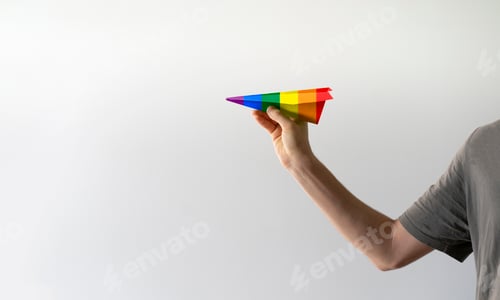 Preview: a paper air plane in the colors of rainbow