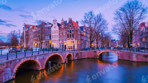 Preview: Amsterdam Netherlands canals with lights during evening in December during winter in the Netherlands