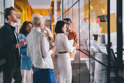 Preview: Team Collaborating on Project in Modern Office