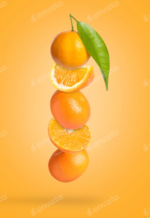 Preview: Ripe juicy tangerines falling on orange background