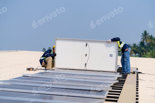 Preview: workers installing solar panels, for efficient energy on rooftop