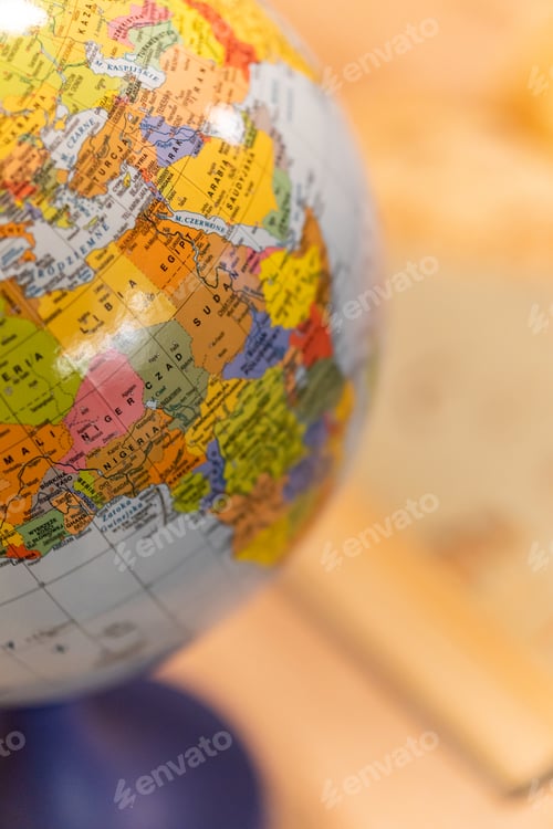 Preview: Vertical shot of a globe model on a desk