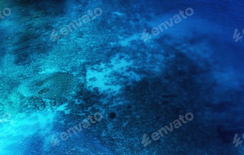Preview: Seascape at the day time. Water as a background. Turquoise water background from top view.