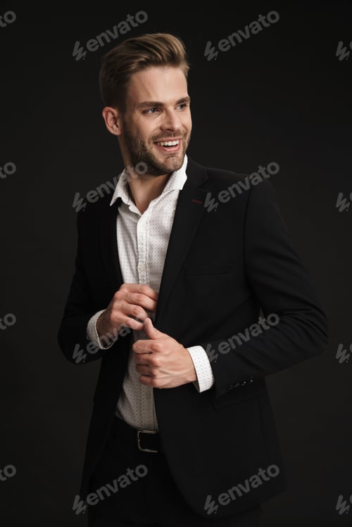 Preview: Happy confident unshaven businessman posing and smiling