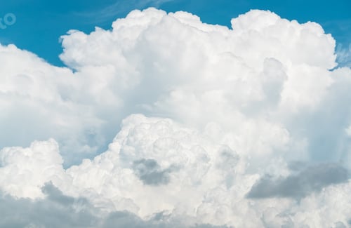 Preview: White fluffy clouds on blue sky. Soft touch feeling like cotton. White puffy clouds cape with space