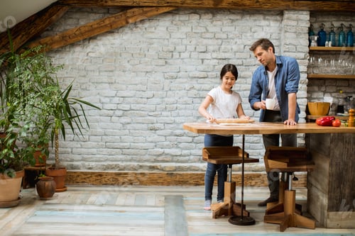Preview: Father and daughter making bread in the rustic kitchen