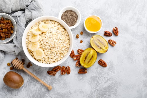 Preview: Oat flakes with fruits, nuts and honey in bowl