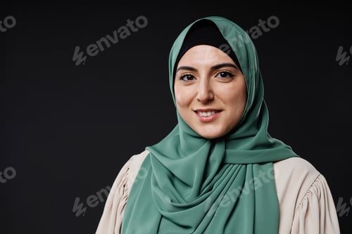 Preview: Muslim Woman Wearing Hijab Smiling at Camera with Confidence