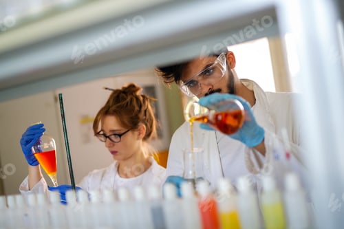 Preview: Young scientists, students of chemistry working in laboratory