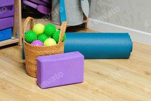 Preview: Yoga accessories in gym or sport studio, yoga block, massage balls and a mat