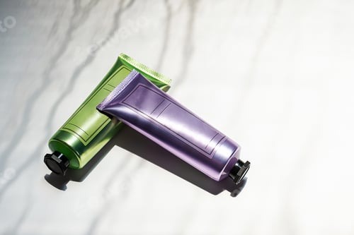 Preview: Shined cosmetic tubes mock up. Skin care cream bottles package with shadow.