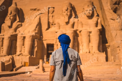 Preview: A Young Tourist In A Blue Turban Looking At The Abu Simbel Temple In Southern Egypt In Nubia Next
