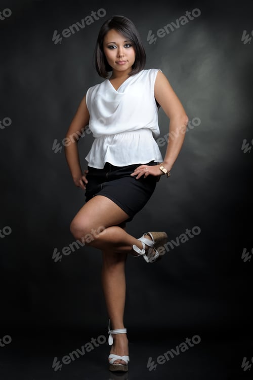 Preview: Pretty Asian Girl In Studio On Black Background