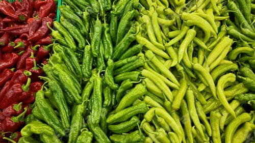Preview: Colorful display of chili peppers in a market setting