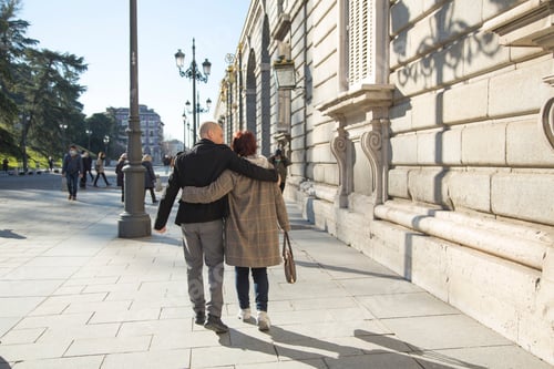 Preview: Senior caucasian couple strolling around the city holding on to each other