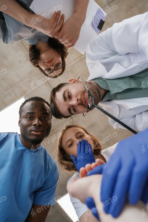Preview: View from below of group of doctors