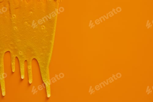 Preview: Cream liquid gel serum flowing down on yellow texture