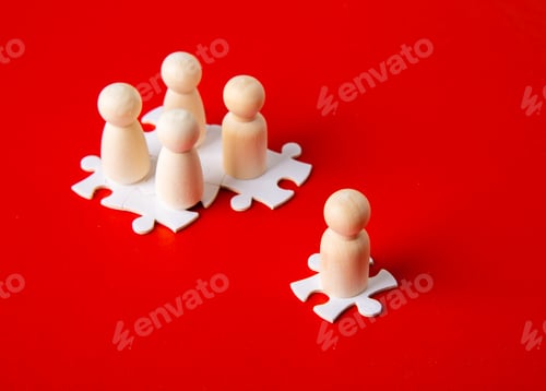 Preview: Wooden figures on puzzles on red background as a symbol of team building.