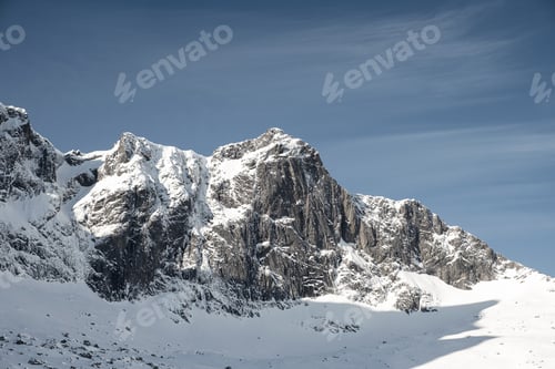 Preview: Snow rocky mountain range and blue sky on winter at Lofoten Islands