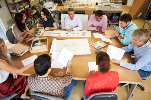 Preview: Group Of Architects Sitting Around Table Having Meeting