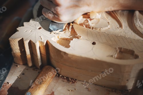 Preview: The carpenter works with a tree