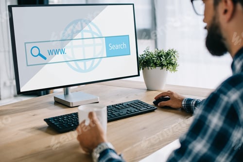 Preview: cropped shot of seo manager with cup of coffee using computer with website