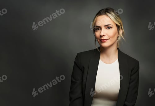 Preview: Professional Woman Wearing Blazer Against Gray Background