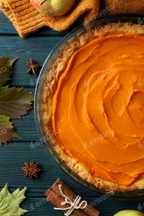 Preview: Concept of tasty food with pumpkin pie on wooden background