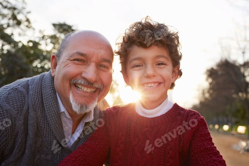Preview: Portrait of grandfather and grandson looking at camera smiling