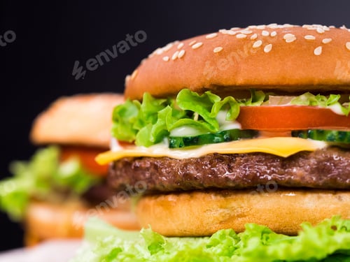 Preview: Fresh yummy grilled burgers on black background.