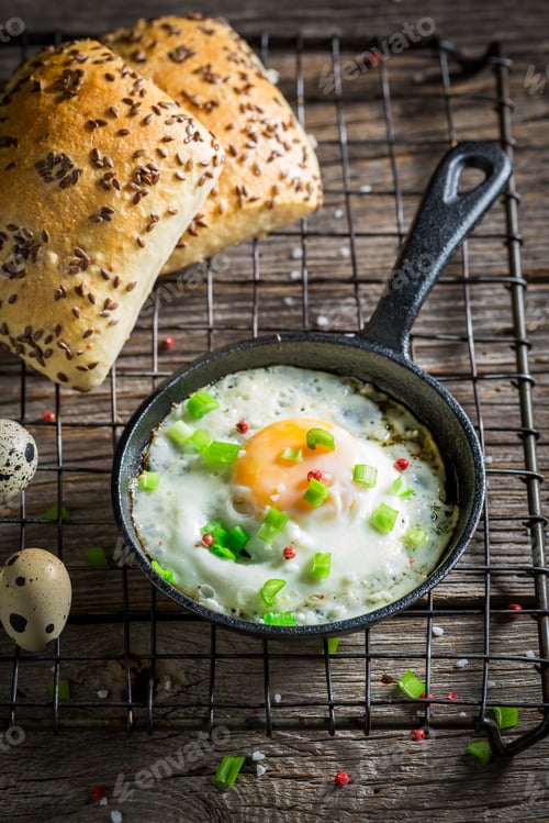 Preview: Tasty and fresh fried eggs served with bun and chive.