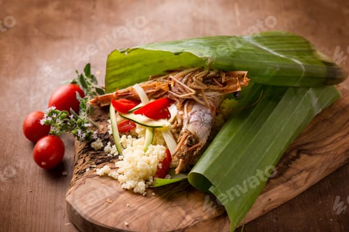 Preview: shrimp coucous with zucchinis cooked on banana leaf