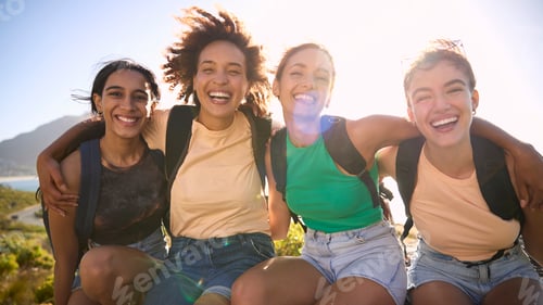 Preview: Portrait Of Female Friends With Backpacks On Vacation Taking A Break On Hike Through Countryside