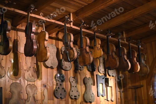 Preview: Violins hanging in luthier workshop