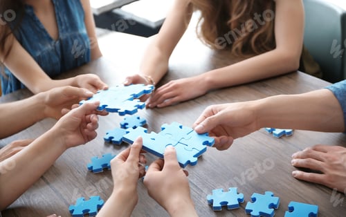 Preview: People with puzzle, closeup of hands. Unity concept