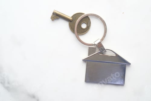 Preview: home finance concept with key and house symbol on white