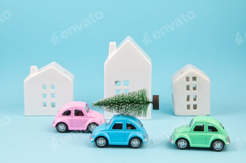 Preview: Small toy car carring christmas tree over the roof. Sesonal holidays, greeting card