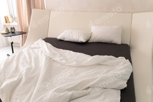 Preview: Two white pillows on large bed