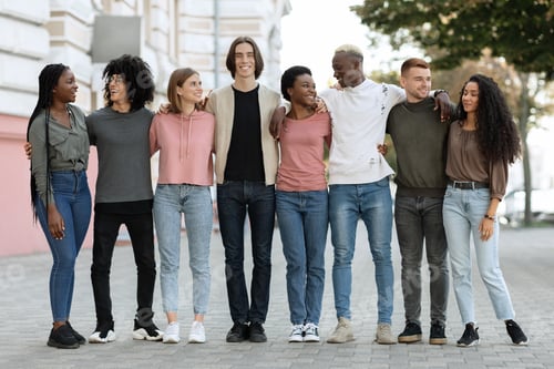 Preview: Multiracial group of happy millennial men and women outdoors, panorama