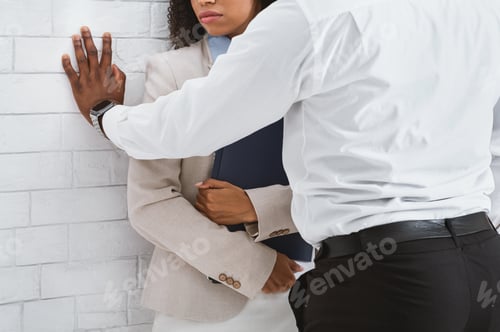 Preview: Workplace harassment. Closeup view of black guy making unwelcome sexual advances to his secretary in