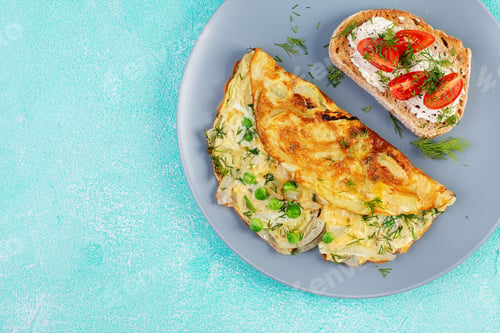 Preview: Omelette with green peas, onions and toast cream cheese, tomatoes
