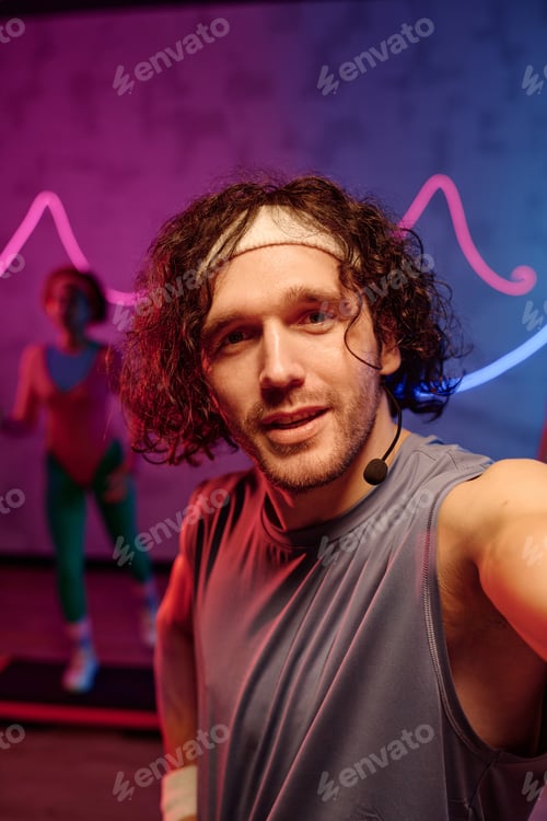 Preview: Man in Retro Attire Taking Selfie at Gym